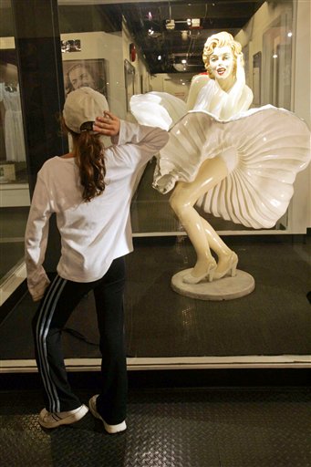 A display of Marilyn Monroe in a famous subway air vent movie scene from 'The Seven Year Itch' (1957), is viewed on the opening of the show 'Marilyn Monroe -The Exhibit,' aboard the Queen Mary, Long Beach, California, November 11, 2005.